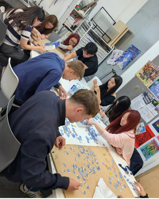 Students collaborating in a Guildhouse classroom